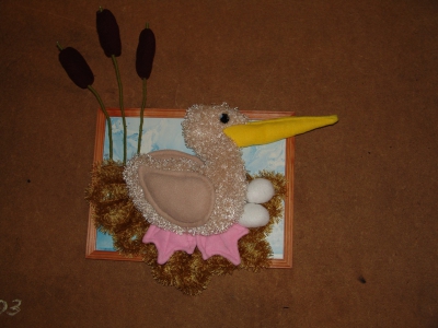 Пеликан в гнезде